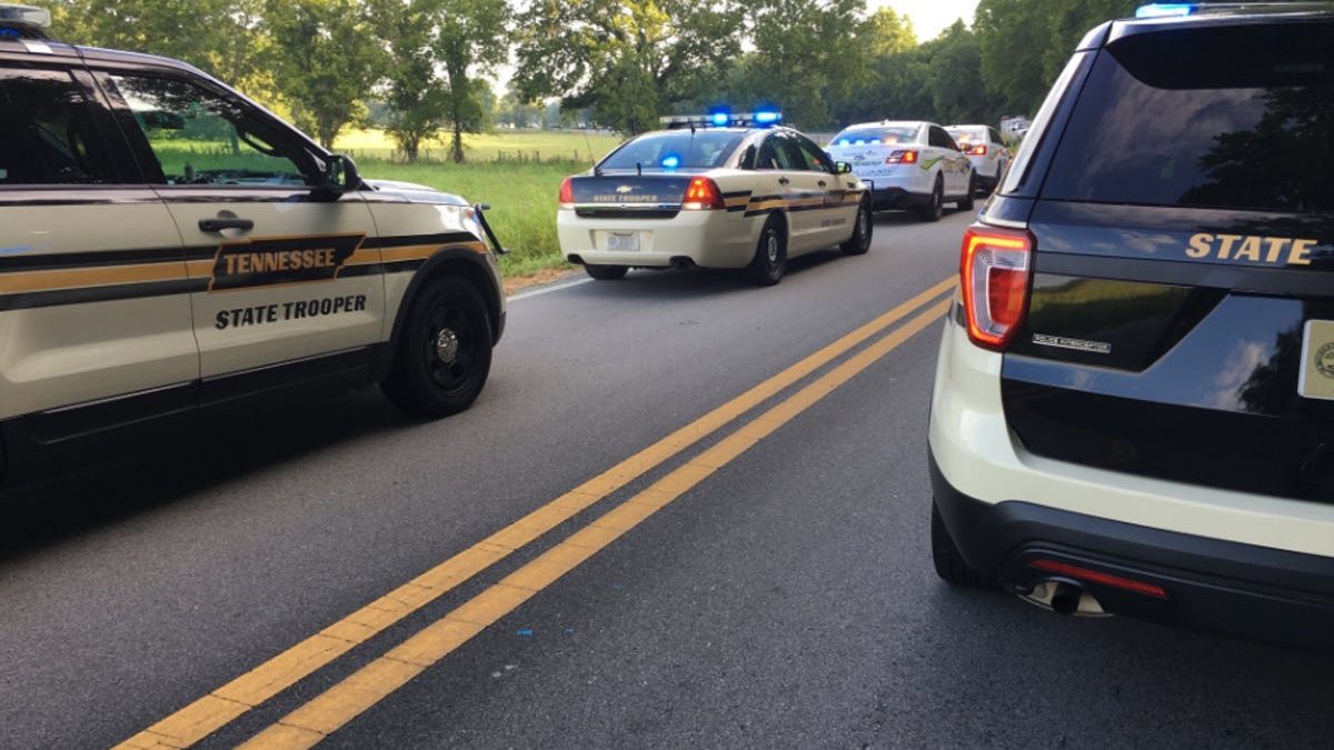 A shooting suspect led authorities on a chase through Tennessee and into Alabama that ended in a head-on collision on I-65