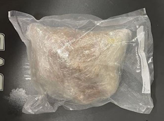A passenger faces a felony drug charge after police found more than a pound of heroin concealed in a piece of luggage at Nashville International Airport